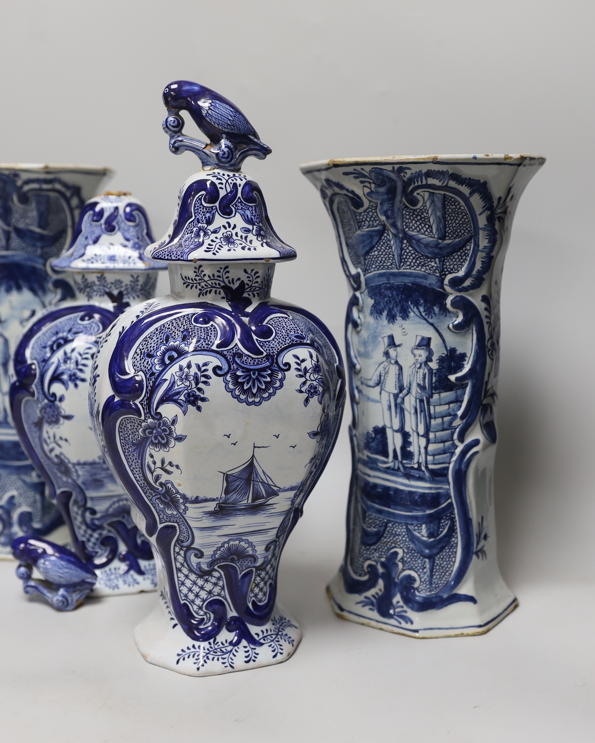 Two pairs of Delft vases, the tall hexagonal vases, 18th century, tallest 30cm